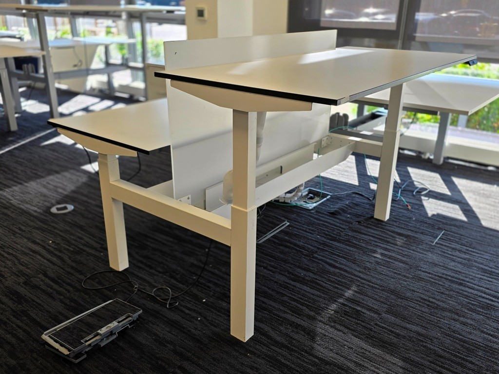 White electric sit-stand bench desks