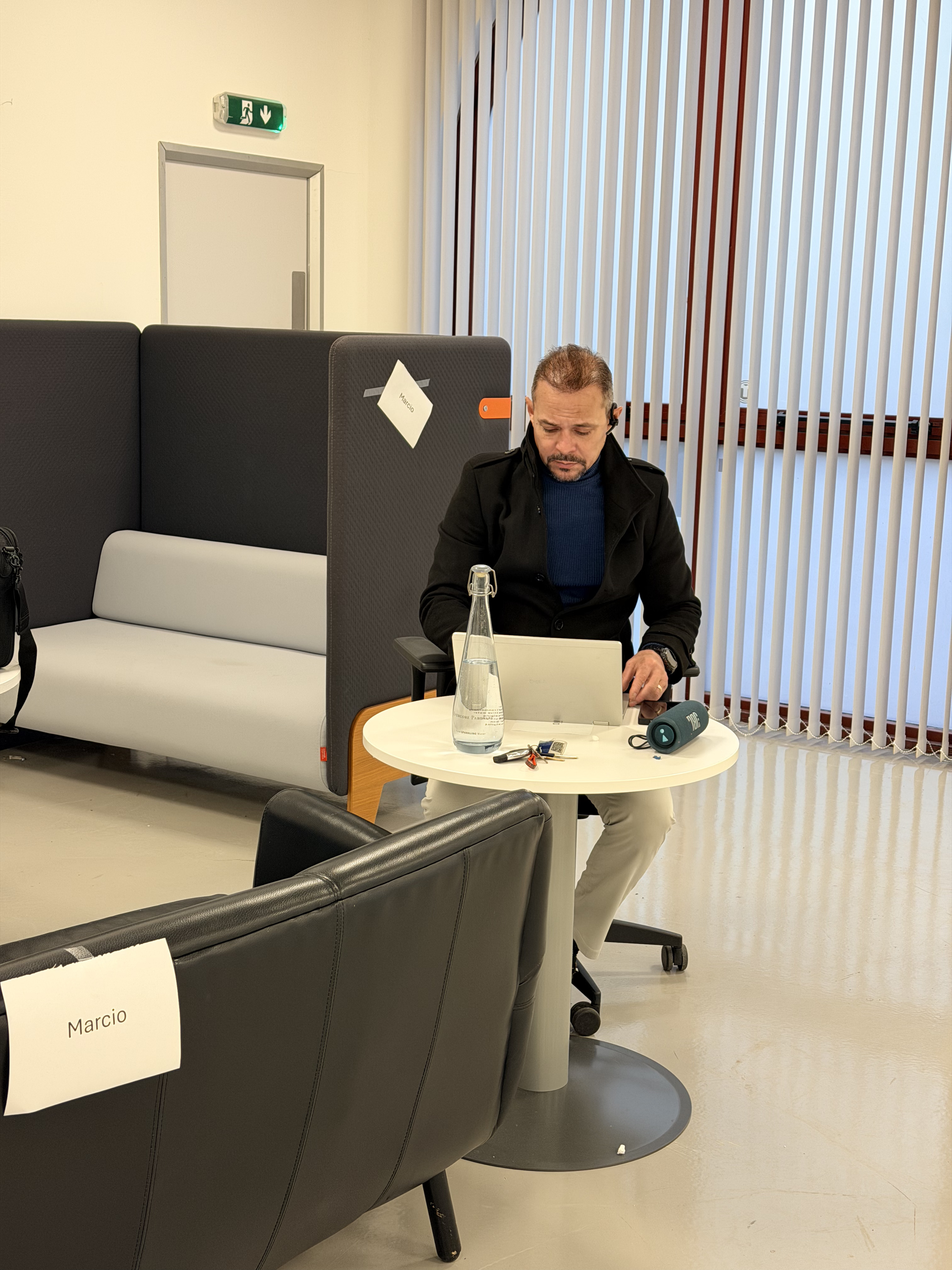 A customer testing refurbished office furniture in the My Used Furniture showroom