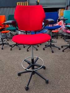 Red Freedom draughtsman chair with chrome footring refurbished