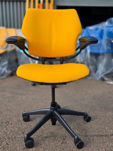 Refurbished Humanscale Freedom ergonomic office chair in yellow upholstery with headrest and chrome base