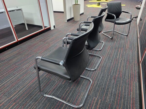 Black Cantilever Visitor chair with a chrome Frame.