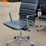 Black Swivel Office Chair with Chrome Arms and Base on Wheels - Faux Leather