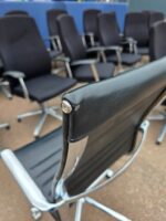 Black Swivel Office Chair with Chrome Arms and Base on Wheels - Faux Leather - Image 3