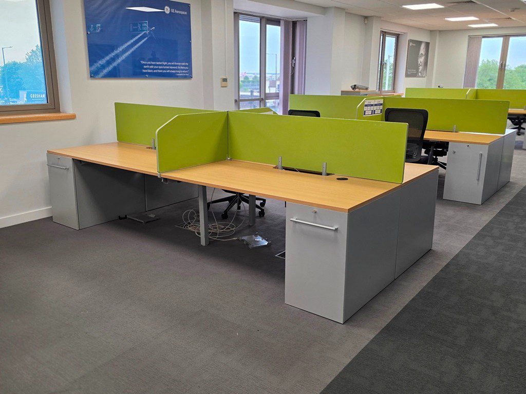 4 person bench desk workstation bank with screens and integrated pedestals