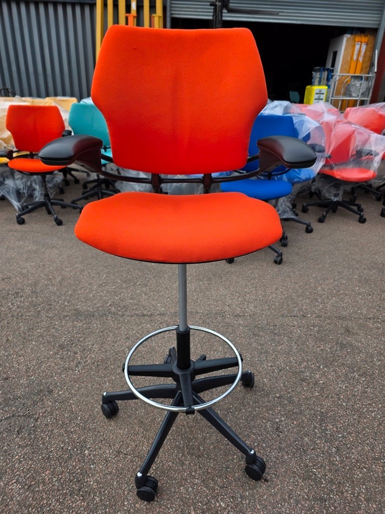 Orange upholstered humanscale freedom chair for creative workspaces
