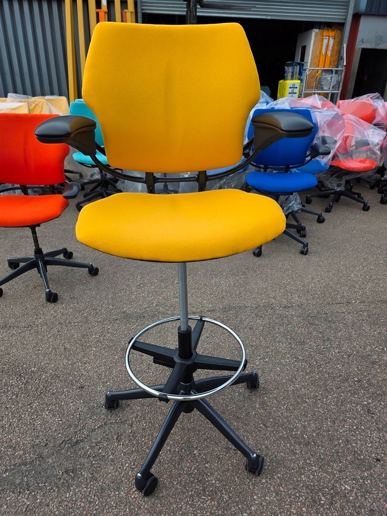 Yellow colourful draughtsman chair for a bright office setup