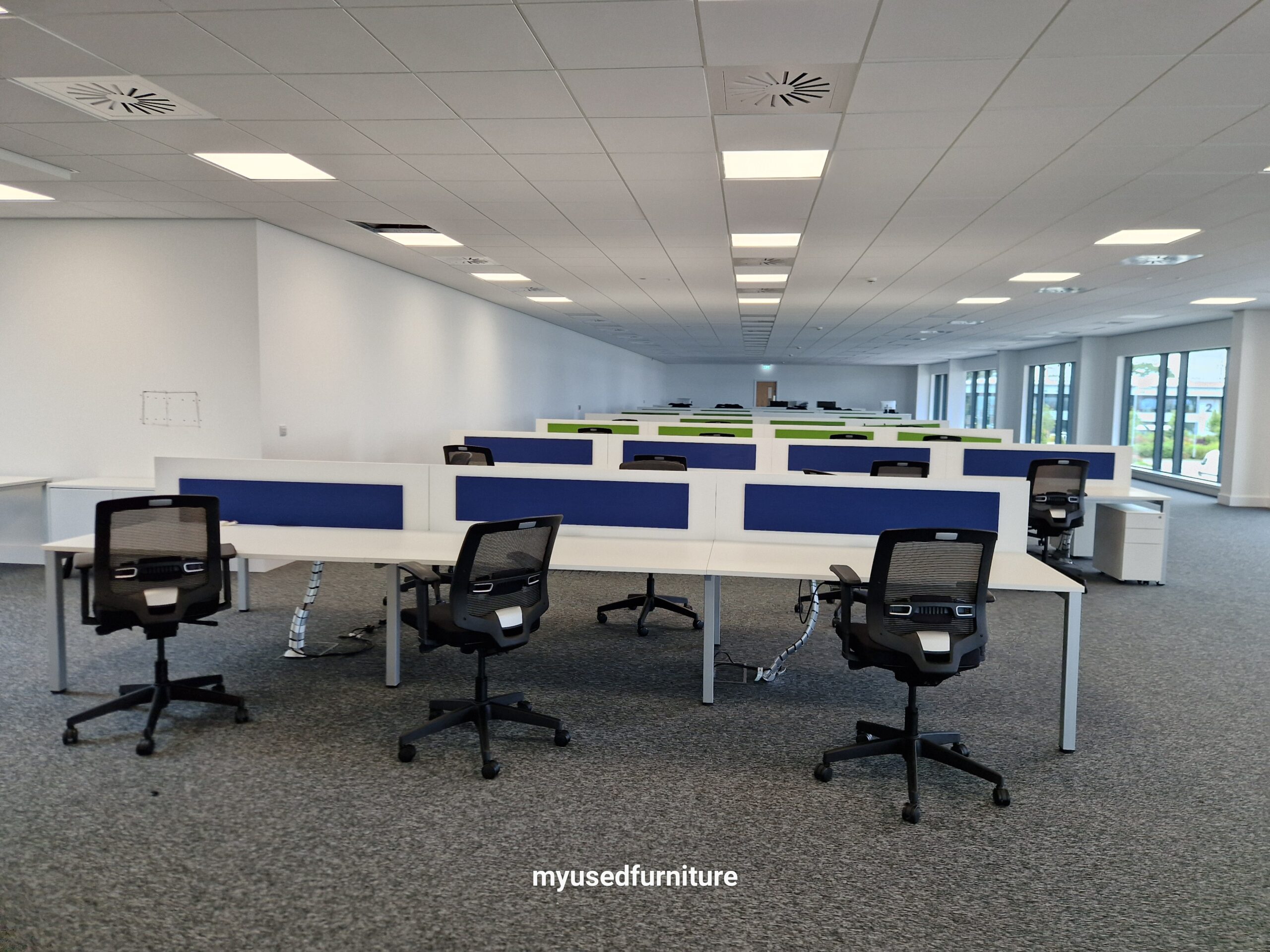 Modern commercial office furnished with used office desks