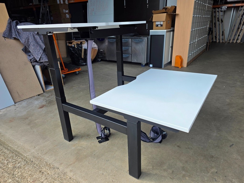 Used office desks prepared for sale in a UK warehouse