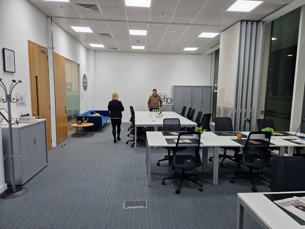 Used office desks arranged in a commercial UK workplace