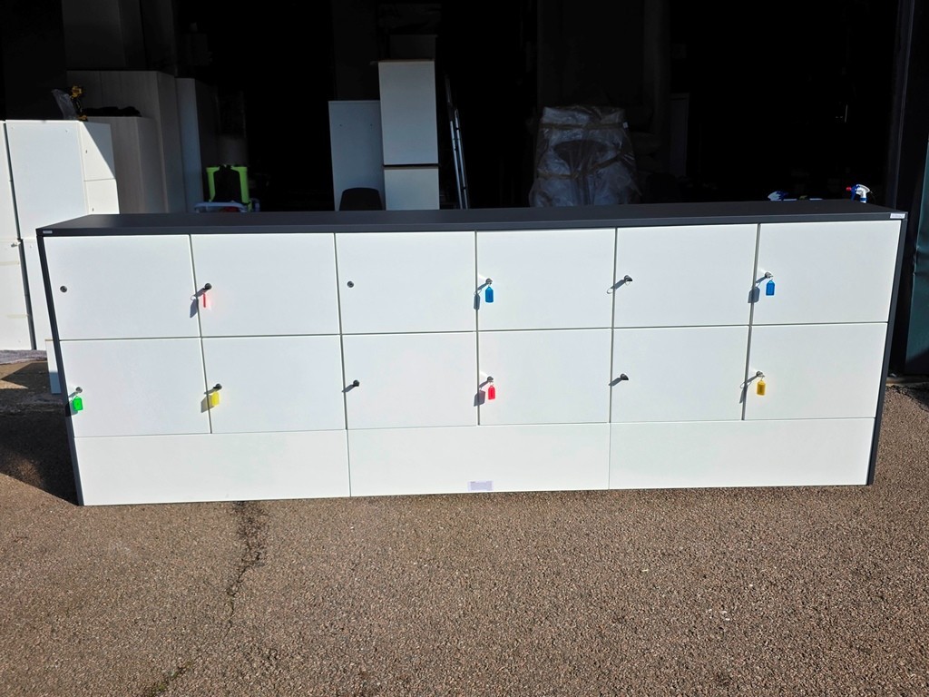 Office storage units positioned beside workplace desks