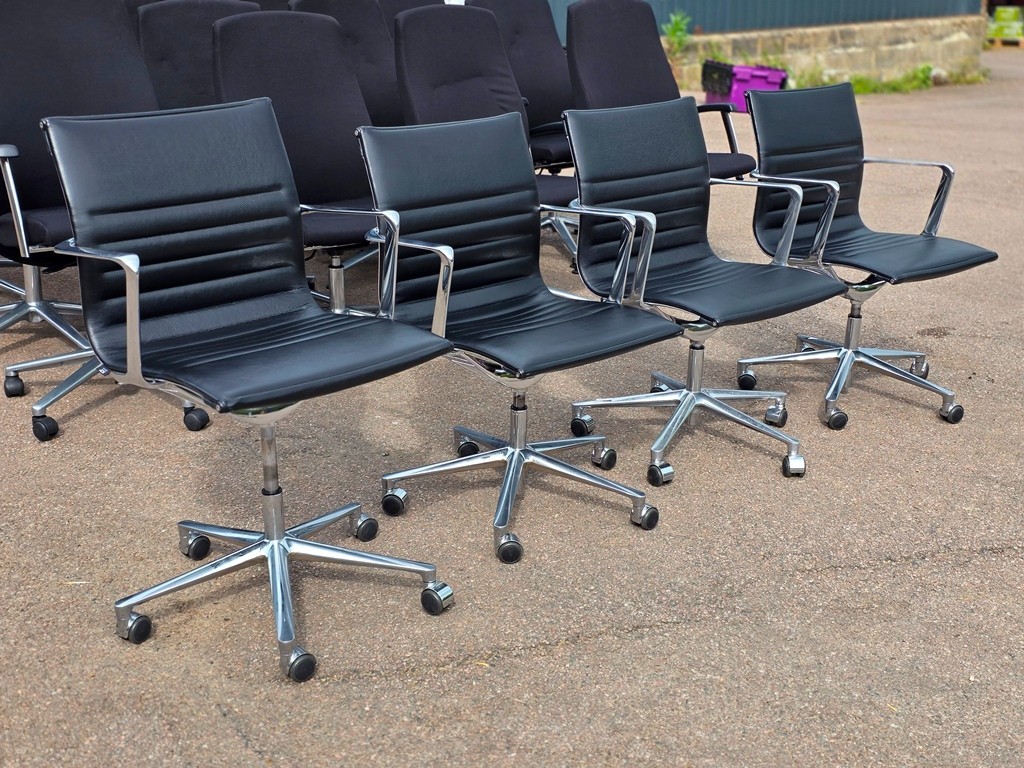 Used meeting and visitor chairs shown around a table and beside a reception desk