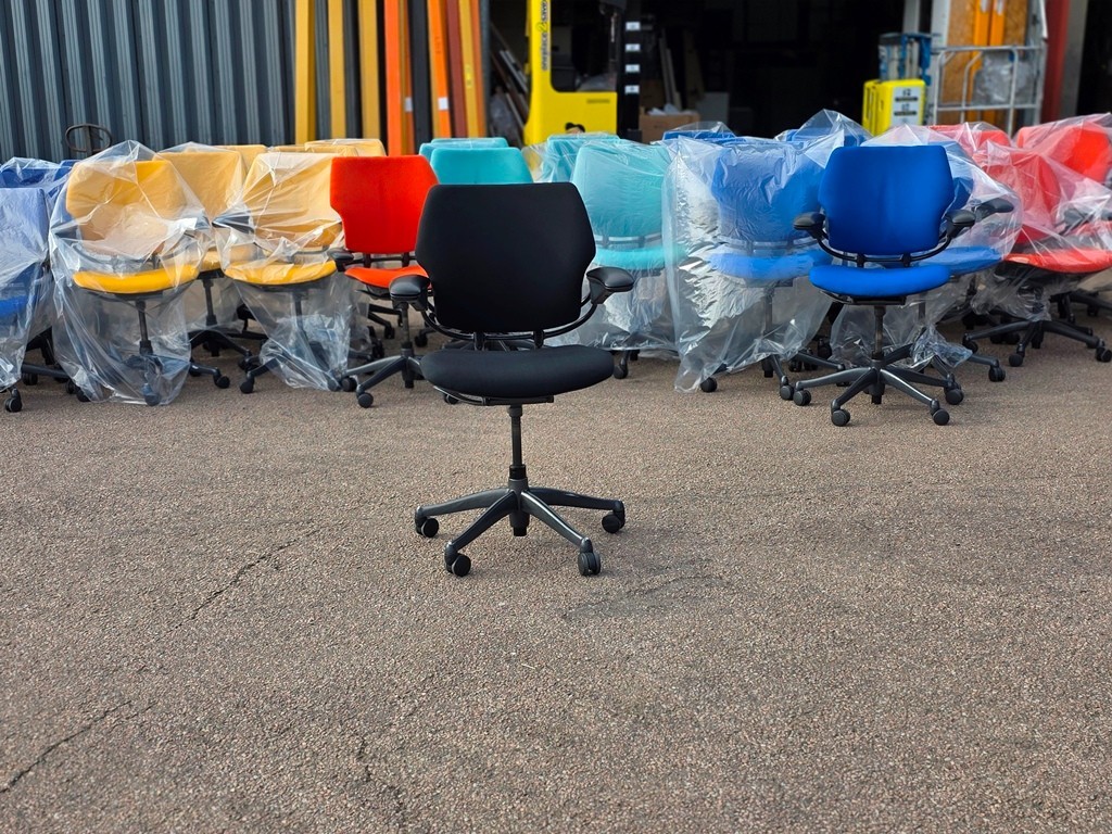 Used office chairs and visitor seating in a workplace