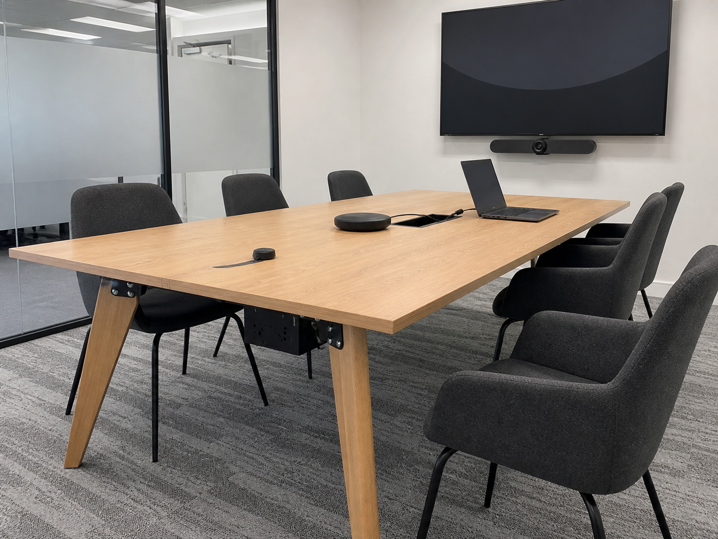 Used meeting table with integrated power module, cable tray and hybrid meeting equipment