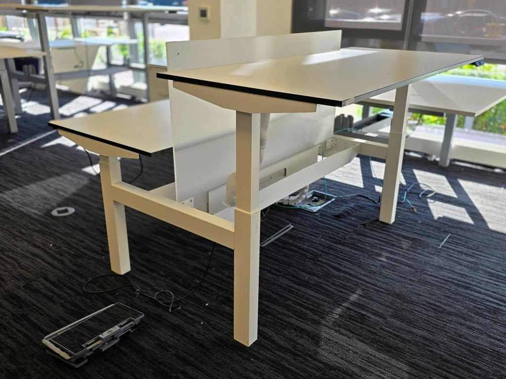 White electric sit-stand bench desks